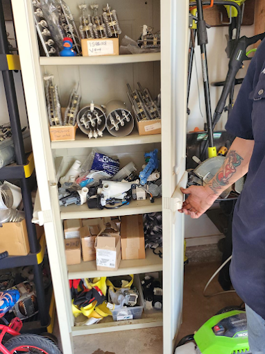 Organized appliance components and replacement parts used during service