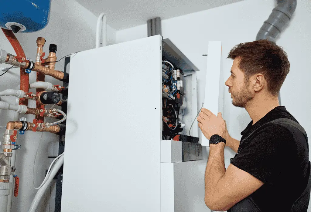Technician inspecting commercial appliance equipment