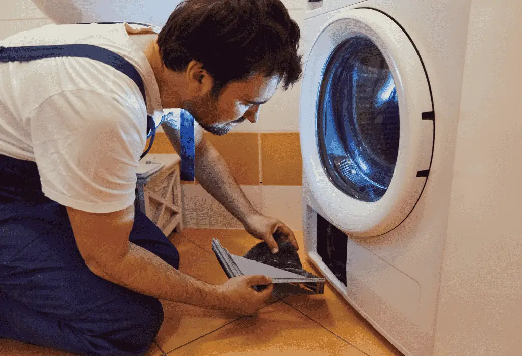 Technician inspecting a residential clothes dryer