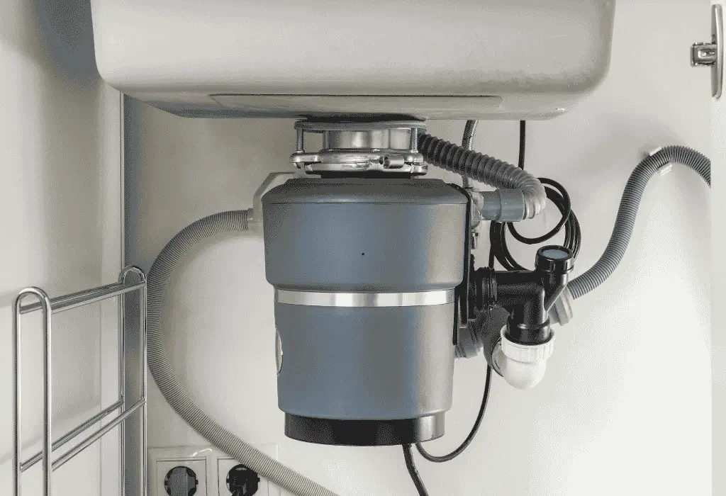 Garbage disposal unit installed under a kitchen sink